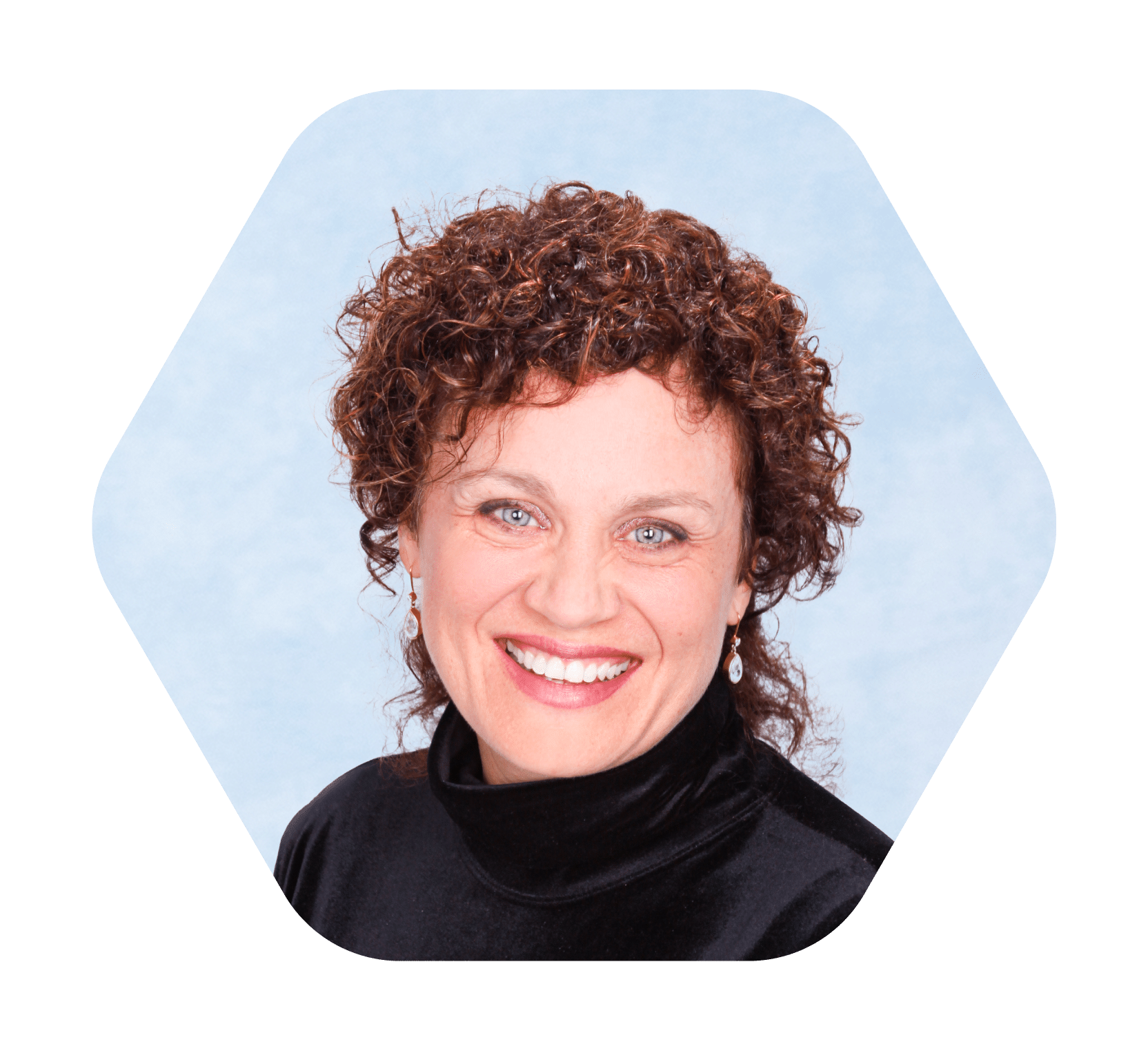 headshot of middle aged woman with curly hair in black smiling with light blue and white background
