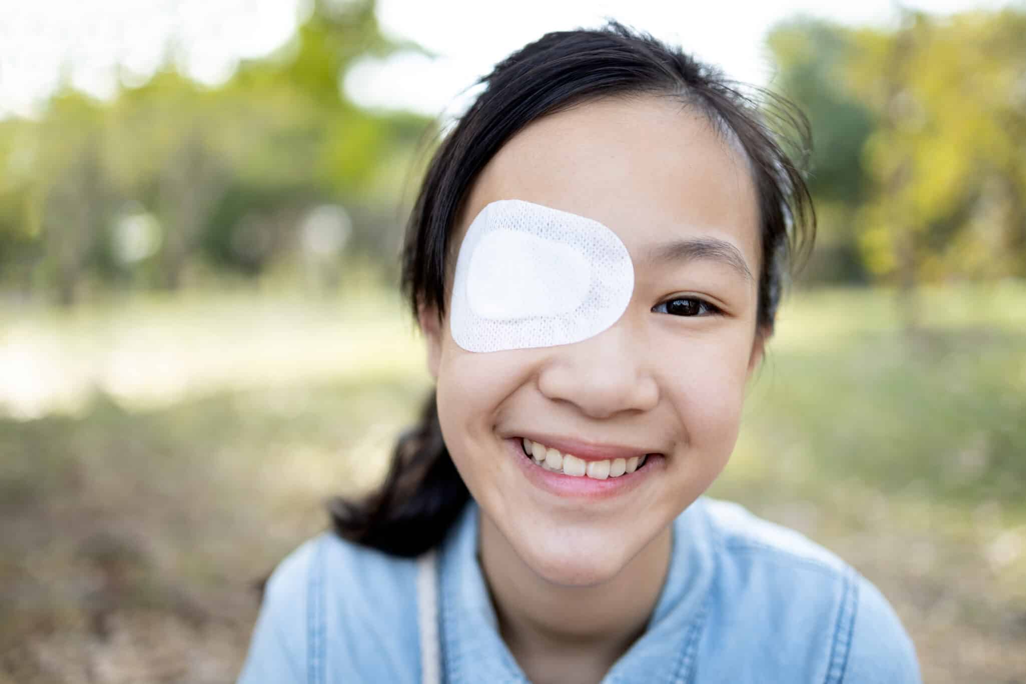 Happy,Asian,Child,Girl,Cover,With,Blindfolded,Bandaged,Eye,After