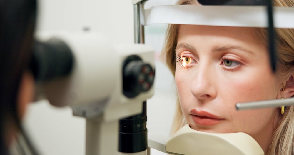 Patient undergoing a vision exam during a consultation for EVO ICL vision correction. Patient undergoing a vision exam during a consultation for EVO ICL vision correction.